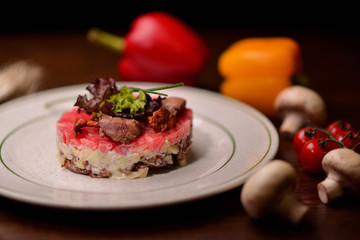 Russian salad with herring and mushrooms