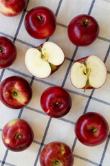 Fresh raw organic red apples on cloth, top view. Flat lay, from above, overhead.