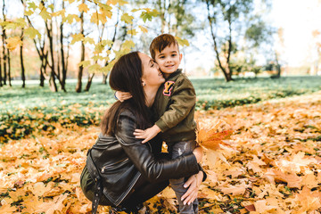 mother and son in autumn park