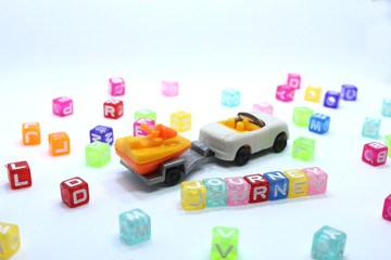 toy car on white background with journey word
