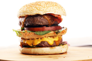 Tasty fresh meat burgers with salad and cheese. Homemade angus burger.