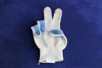 Work glove, made of fabric and with anti-slip rubber on the fingers.