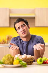Young man in dieting and healthy eating concept