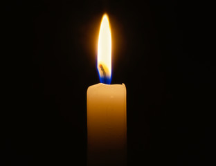 candle lit in darkness with high detail and focus.