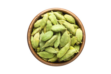 cardamom seeds spice in wooden bowl, isolated on white background. Seasoning top view