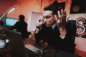 Businessman Talking on Phone on New Year Eve.