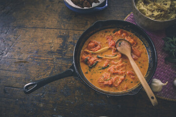 Italian tomato and cheese gravy in an iron skillet.