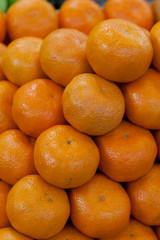 Background of half cut oranges on orange background