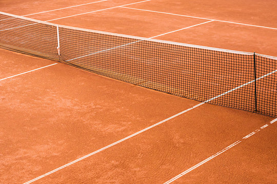 Empty Clay Tennis Court