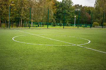 football field in a city public park, field center