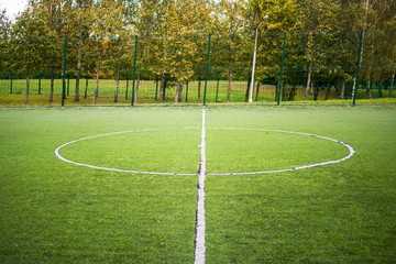football field in a city public park, field center