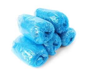 Medical blue shoe covers on white background
