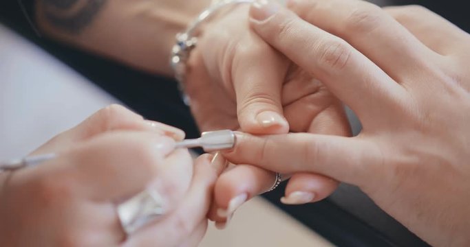 Close up of male hands getting manicure