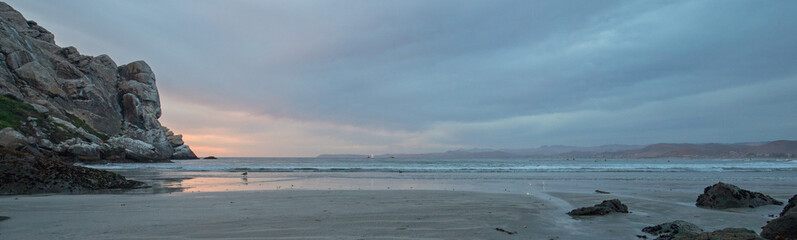 Twilight Evening Sunset at Morro Rock on the central coast of California at Morro Bay California United States