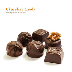 Assortment of chocolate candies from black, milk and white chocolate with nuts and marzipan