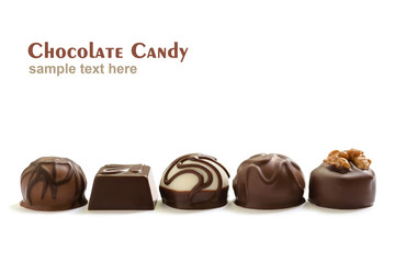 Assortment of chocolate candies from black, milk and white chocolate with nuts and marzipan