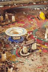 Close up of a retro pinball machine found in an abandoned house