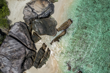 Tropical beach with sea and palm taken from drone. Beach and sea photo. Romantic beach aerial view.
