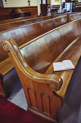 Old wooden church pews. Close-up