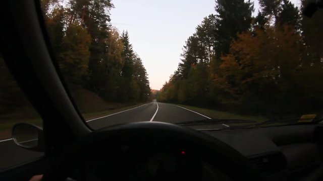 car ride on winding autumn winding road.