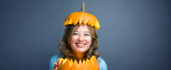 Portrait of beautiful cheerful woman with pumpkin Thanksgiving day 
