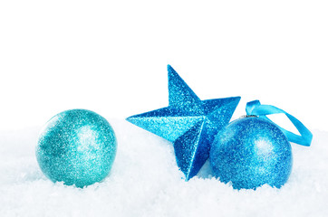 Christmas colored balls with star on snow isolated background