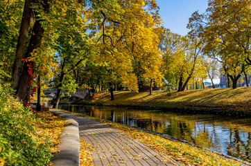 Sunny autumnal day in central public park of Riga - capital of Latvia and a major commercial, cultural, historical and financial center of the Baltic region