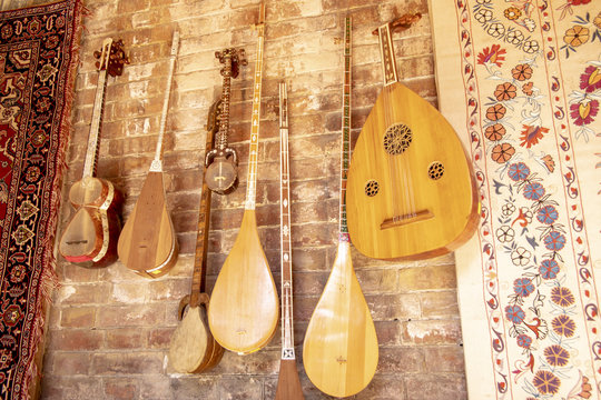 Traditional Suzani tapestry and musical instruments , Uzbekistan