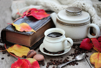 Autumn leaves, book and cup of black coffee. Background for website, bloggers, social media. Fashion flat lay