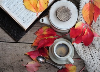 Autumn leaves, book and cup of black coffee. Background for website, bloggers, social media. Fashion flat lay