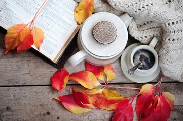 Autumn leaves, book and cup of black coffee. Background for website, bloggers, social media. Fashion flat lay