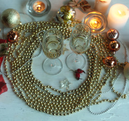 new years eve party table with champagne ,candles,tree decorations