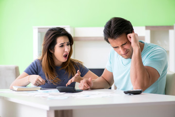 Fototapeta premium Young family struggling with personal finance