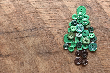 sewing buttons in the shape of an evergreen tree