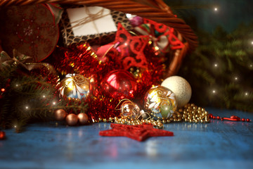 Christmas decoration in wicker basket with fir branches on the wooden board.Christmas and New year card