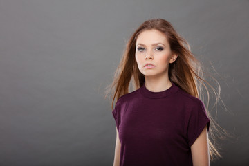 Attractive brunette woman with windblown hair