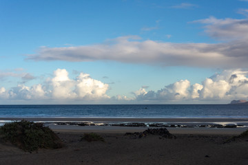 early morning over a calm ocean and beach