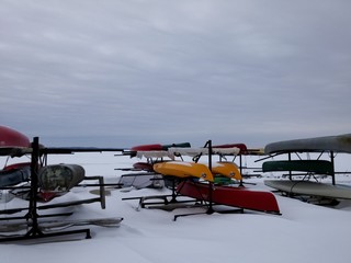 Boats parked upside down during the winter season as the lake is frozen