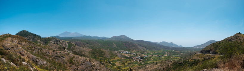 Fototapeta na wymiar landscape panorama , green valley with mountain Teide background and clear blue sky, Tenerife