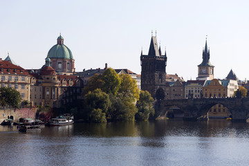Fototapeta na wymiar Prague Old Town with Bridge Tower and St. Francis of Assisi Cathedral and Charles Bridge with its baroque Statues, Czech republic