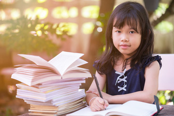 Close up of Portrait Girl drawing outdoor in park.