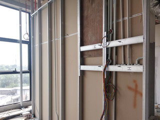 KUALA LUMPUR, MALAYSIA -MARCH 29, 2018: Drywall installation work in progress by construction...