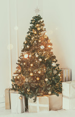 Holiday decorated room with Christmas tree and decoration, backgroound with blurred, sparking, glowing light. Happy New Year