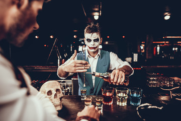 Bartender in Halloween Costume Making Cocktail