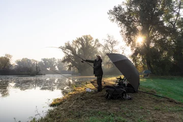 Foto auf Acrylglas Antireflex Man fishing on a sunny morning © zlatkozalec