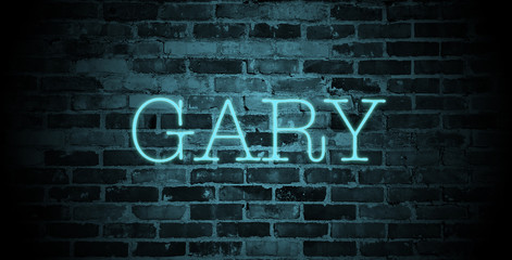 first name Gary in blue neon on brick wall