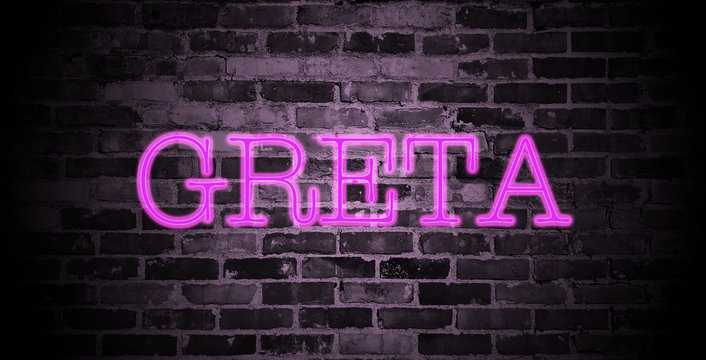 first name Greta in pink neon on brick wall