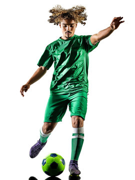 one mixed race young teenager soccer player man playing  in silhouette isolated on white background