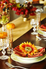 Thanksgiving table setting. Autumn table setting with small pumpkins