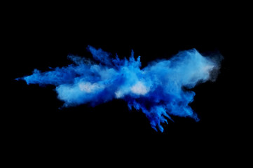 Bizarre forms of powder paint and flour combined  together explode in front of a black background...